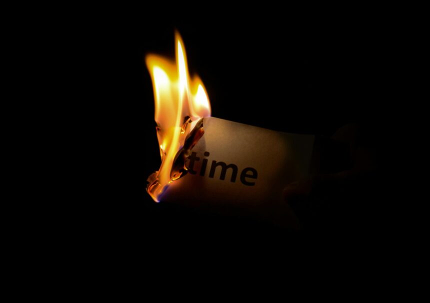 pexels photo person holding burning paper in dark room