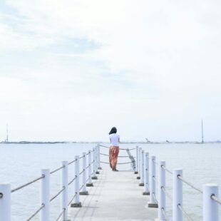 pexels photo 460211 woman standing on dock