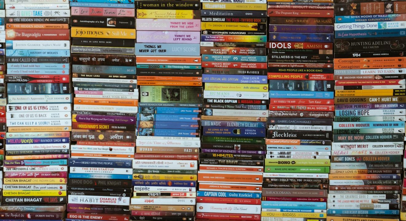 pexels photo 33703389 colorful array of books stacked in delhi market